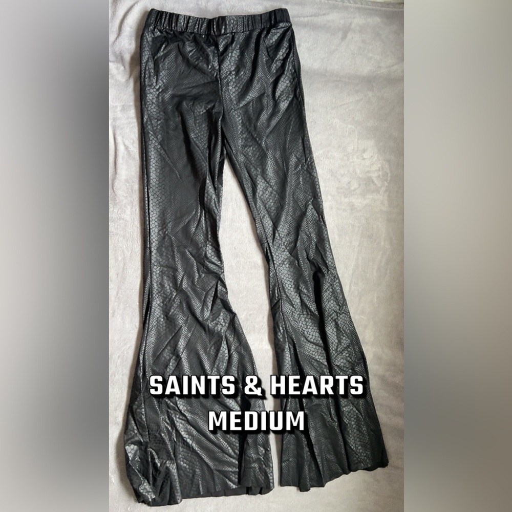 Medium black faux leather snake print flair/bell bottom pants.